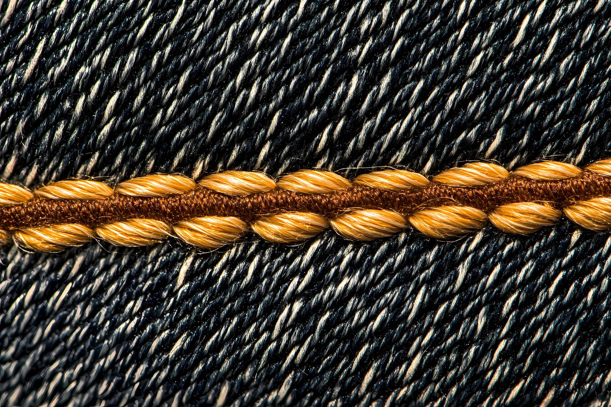 Close-up of premium embroidered textile with metallic threads